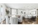 Eat-in kitchen area featuring modern decor, a round wooden table, and white cabinetry at 8867 S Zante St, Aurora, CO 80016