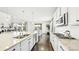 Modern kitchen featuring stainless steel appliances, a center island, and hardwood flooring at 8867 S Zante St, Aurora, CO 80016