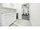 Well-organized laundry room featuring ample cabinet space and stylish backsplash at 8867 S Zante St, Aurora, CO 80016