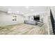 Open living room featuring wood-style floors, recessed lighting, and lots of natural light at 8867 S Zante St, Aurora, CO 80016