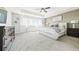 Primary bedroom suite with tray ceilings, carpet, and lots of natural light at 8867 S Zante St, Aurora, CO 80016