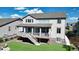 Well-maintained backyard with a spacious deck and stairs leading to a lush green lawn at 8867 S Zante St, Aurora, CO 80016