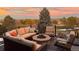 Outdoor seating area with fire pit, perfect for enjoying scenic sunset views at 1621 Beacon Hill Dr, Highlands Ranch, CO 80126