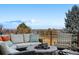 Back deck with comfortable seating, perfect for entertaining and enjoying mountain views at 1621 Beacon Hill Dr, Highlands Ranch, CO 80126