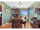 Elegant dining room with hardwood floors, large window, and custom built-in cabinet at 1621 Beacon Hill Dr, Highlands Ranch, CO 80126