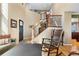 Inviting foyer with hardwood floors, a staircase, and a glimpse into the open-concept living space at 1621 Beacon Hill Dr, Highlands Ranch, CO 80126