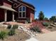 Home featuring professional landscaping, a brick pathway, and a well-manicured lawn at 1621 Beacon Hill Dr, Highlands Ranch, CO 80126