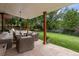 Covered patio with wicker furniture and stone flooring at 7205 S Newport Way, Centennial, CO 80112