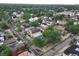 An aerial view showcases the neighborhood's blend of residential buildings with tree-lined streets in an established area at 1707 W 39Th Ave, Denver, CO 80211