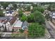 This aerial view showcases a charming neighborhood with a mix of architectural styles and lush, mature trees lining the streets at 1707 W 39Th Ave, Denver, CO 80211