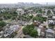 This aerial view showcases a charming neighborhood with a mix of architectural styles and lush, mature trees lining the streets at 1707 W 39Th Ave, Denver, CO 80211