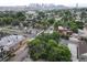 This aerial view showcases a charming neighborhood with a mix of architectural styles and lush, mature trees lining the streets at 1707 W 39Th Ave, Denver, CO 80211