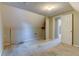 Finished attic showcases carpet, white trim, and an interior door with a peek into another space at 1707 W 39Th Ave, Denver, CO 80211