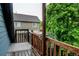 Back deck shows the exterior and tree-covered lot behind the house at 1707 W 39Th Ave, Denver, CO 80211