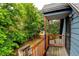 Back deck offering peaceful views of the backyard lawn and mature trees at 1707 W 39Th Ave, Denver, CO 80211