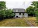 Backyard featuring a well-maintained lawn and mature trees at 1707 W 39Th Ave, Denver, CO 80211