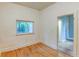 Bright bedroom offers hardwood floors, a window for natural light, and a doorway to other rooms at 1707 W 39Th Ave, Denver, CO 80211