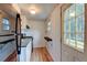 Galley kitchen featuring a stainless steel refrigerator and gas range at 1707 W 39Th Ave, Denver, CO 80211