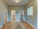 Bright living room featuring hardwood floors and multiple doorways at 1707 W 39Th Ave, Denver, CO 80211