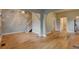 Inviting living space showcasing hardwood floors, staircase, and seamless transitions to other rooms at 1707 W 39Th Ave, Denver, CO 80211
