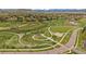 Community park offering green space, a playground, walking paths, and a serene pond at 15258 W 75Th Pl, Arvada, CO 80007