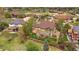 Aerial view of a home featuring a patio, fence, mature trees, and landscaping at 15258 W 75Th Pl, Arvada, CO 80007