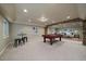 Spacious basement with pool table, bar seating, and cozy living area at 15258 W 75Th Pl, Arvada, CO 80007