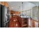 Spacious kitchen with stainless steel appliances, a large island, and ample cabinet space for storage at 15258 W 75Th Pl, Arvada, CO 80007