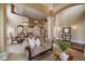 Inviting living room boasting high ceilings, a staircase, and a seamless transition to the dining area at 15258 W 75Th Pl, Arvada, CO 80007