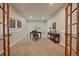 Home office space featuring neutral walls, carpet flooring, and a dark wood desk, perfect for working from home at 15258 W 75Th Pl, Arvada, CO 80007