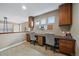 Dedicated office space with built-in desks, cabinets, and natural light from multiple windows at 15258 W 75Th Pl, Arvada, CO 80007