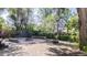 Backyard showcasing a fire pit, tire swing, and mature trees at 2260 Lilly Dr, Thornton, CO 80229