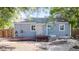 Charming single-story home with backyard, deck, and paved patio space at 2260 Lilly Dr, Thornton, CO 80229