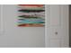 Bedroom closet and modern art on wall at 2260 Lilly Dr, Thornton, CO 80229