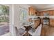 A bright dining area adjacent to the kitchen, offering a cozy space for meals with views of the outdoors at 2260 Lilly Dr, Thornton, CO 80229