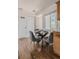 A charming dining area with a glass table next to a window, offering a bright and pleasant atmosphere at 2260 Lilly Dr, Thornton, CO 80229