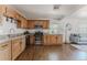 Updated kitchen featuring stainless steel appliances, granite countertops, and wood cabinetry at 2260 Lilly Dr, Thornton, CO 80229