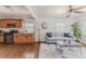 Open concept living room flowing from kitchen features modern decor and plenty of natural light at 2260 Lilly Dr, Thornton, CO 80229