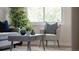 Bright seating area with stylish coffee table, throw pillows, and plants at 2260 Lilly Dr, Thornton, CO 80229