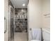 Modern bathroom with tiled shower and glass door at 7250 Eastmoor Dr # 105, Denver, CO 80237