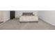 Inviting bedroom with neutral carpeting features a comfortable bed and ample closet space at 7250 Eastmoor Dr # 105, Denver, CO 80237