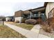 Apartment building exterior with walkways, stairs, and landscaping at 7250 Eastmoor Dr # 105, Denver, CO 80237