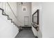 Entryway foyer featuring a staircase with decorative railings, high ceilings, and a large mirror at 7250 Eastmoor Dr # 105, Denver, CO 80237