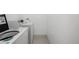 Laundry room featuring appliances and a tile floor at 7250 Eastmoor Dr # 105, Denver, CO 80237