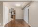 Open floor plan with hardwood floors leading to a bright kitchen at 7250 Eastmoor Dr # 105, Denver, CO 80237