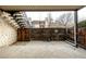 Private patio area with concrete flooring and wooden fence at 7250 Eastmoor Dr # 105, Denver, CO 80237