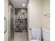 The shower features stylish tile walls, modern fixtures, and convenient accessibility at 7250 Eastmoor Dr # 105, Denver, CO 80237