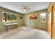 Bedroom with windows offering outdoor views and neutral carpeting at 28065 Camel Heights Cir, Evergreen, CO 80439