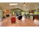 Inviting living room with a stone fireplace, adjacent to the kitchen, and ample natural light at 28065 Camel Heights Cir, Evergreen, CO 80439