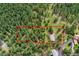 An aerial view outlining the property lines of the land and the home's placement at 28065 Camel Heights Cir, Evergreen, CO 80439